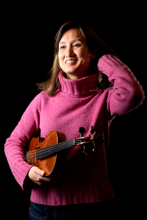 jazz violinist holding violin